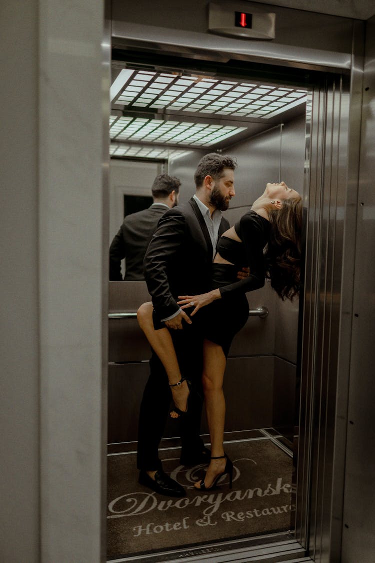 Couple Inside The Elevator