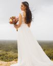 Bride Holding Bouquet of Flowers