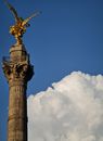 Brown Concrete Tower Under Blue Sky and White Clouds