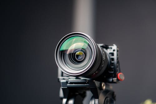Free Sony MILC a6300 camera with a Sigma 24-70 zoom lens in a camera rig, video studio Stock Photo