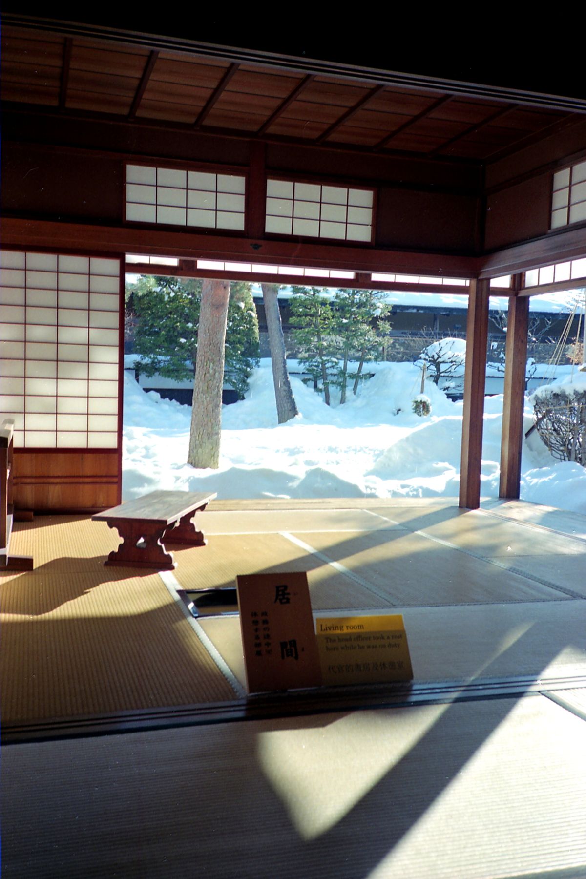 Traditional Japanese tatami room with view of snowy garden