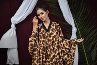 Woman in Brown and Beige Leopard Print Robe