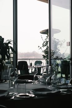 Fine dining table setting with glassware and Istanbul's iconic skyline in the distance.