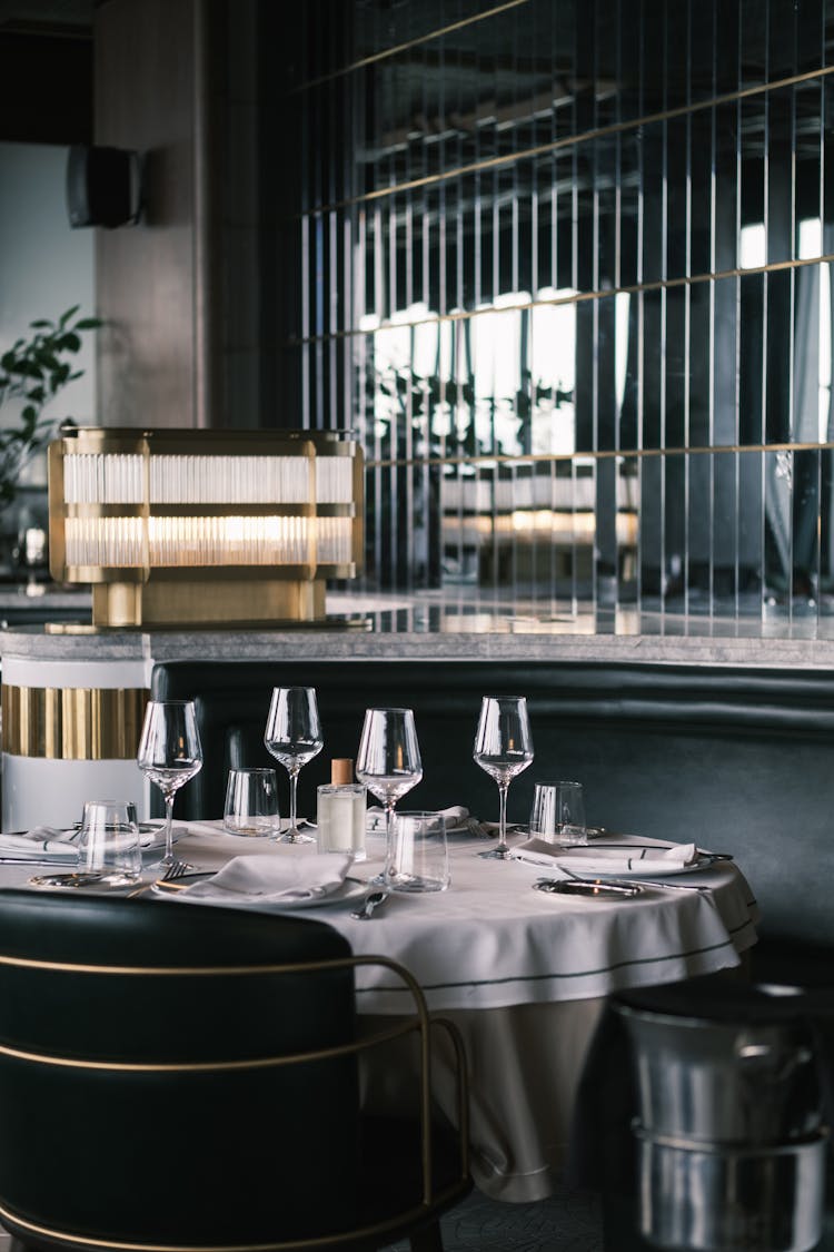 Round Table In Restaurant Set For Four 