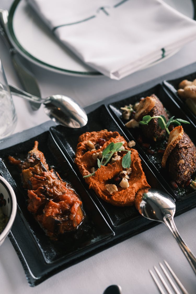 Variety Of Cooked Food Served On A Black Plate