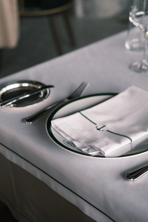 Table Setting of Branded Plate Cutlery and Serviette 
