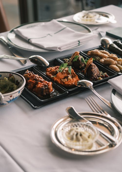 Free Meat and Vegetable Appetizers Served on Restaurant Table Stock Photo