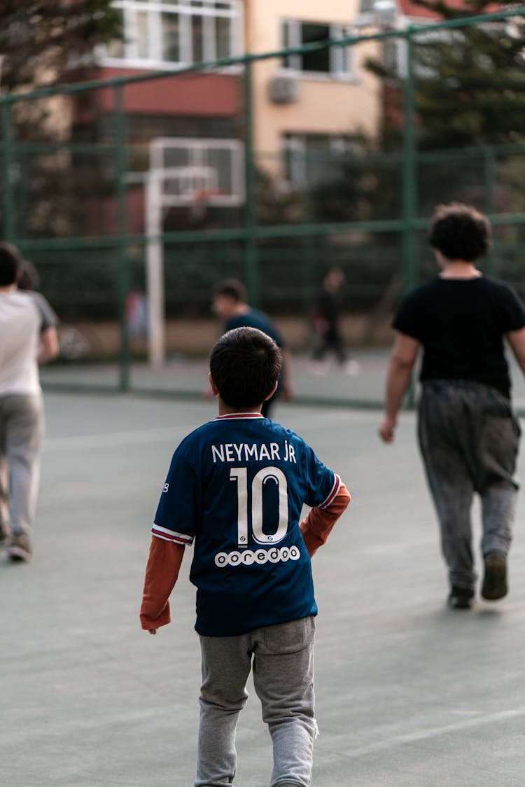 Back View Of A Child Wearing A Jersey