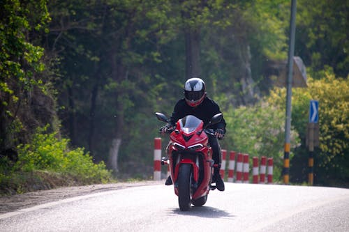 A Person Riding a Red Motorbike