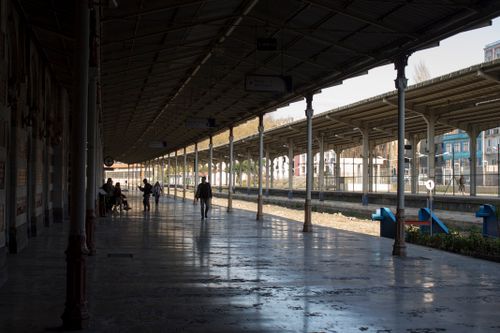 Free Commuters walking on a historic train station platform in Istanbul, Turkey. Stock Photo