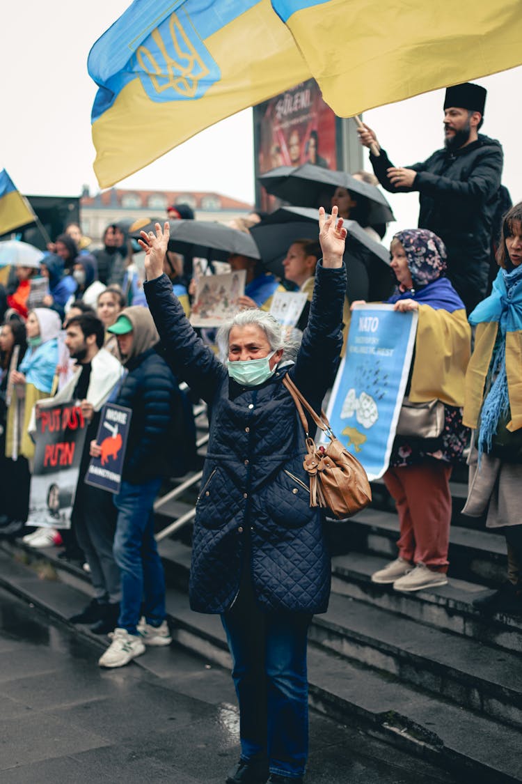 People Protesting With Ukrainian Flags