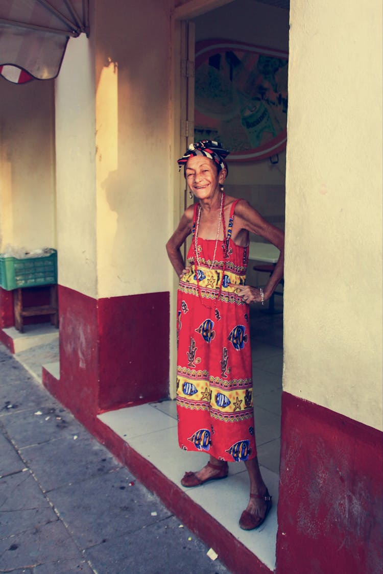 An Elderly Woman In Floral Robe