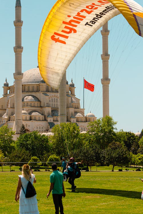 A Person Hanging on the Yellow Parachute