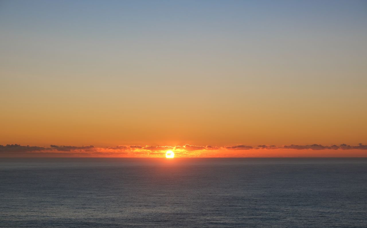 a breathtaking view of the ocean under a vibrant sunrise perfect for s