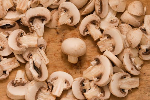 Whole Mushroom Amid Cut Mushrooms