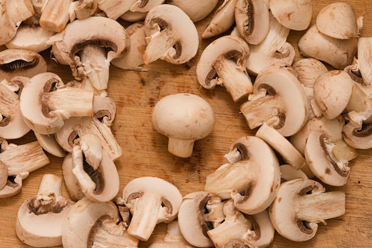 Whole Mushroom Amid Cut Mushrooms