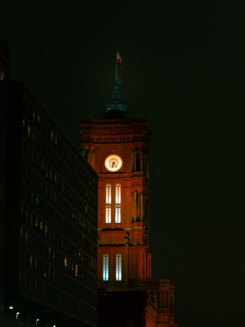 Free A beautifully lit clock tower stands tall against the night sky, showcasing architectural elegance. Stock Photo