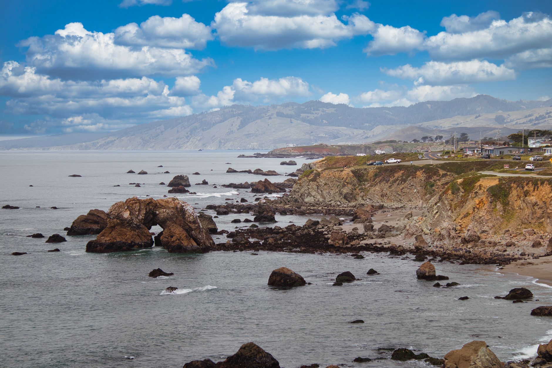 Rugged rock formations along the Bodega Bay coastline at dusk