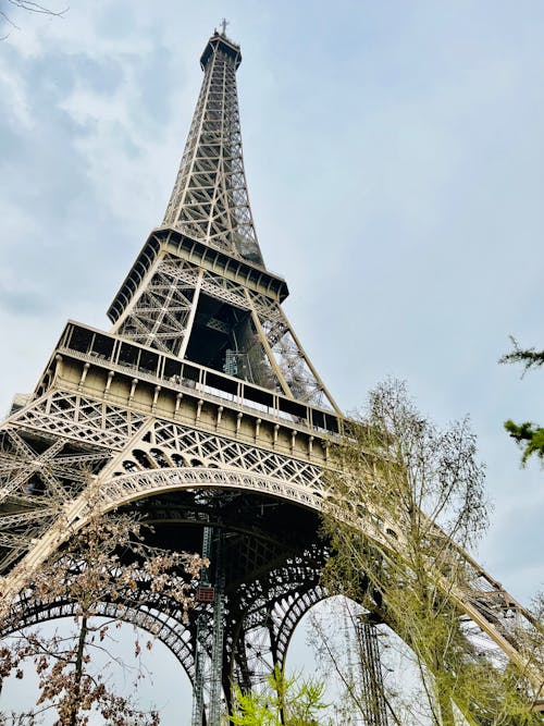 Low-Angle Shot of the Eiffel Tower Under the Clouds