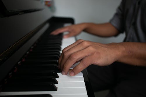 Close-Up Shot of a Person Playing Piano