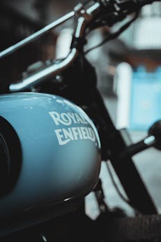 Classic Royal Enfield motorcycle with vintage styling captured in a close-up view.