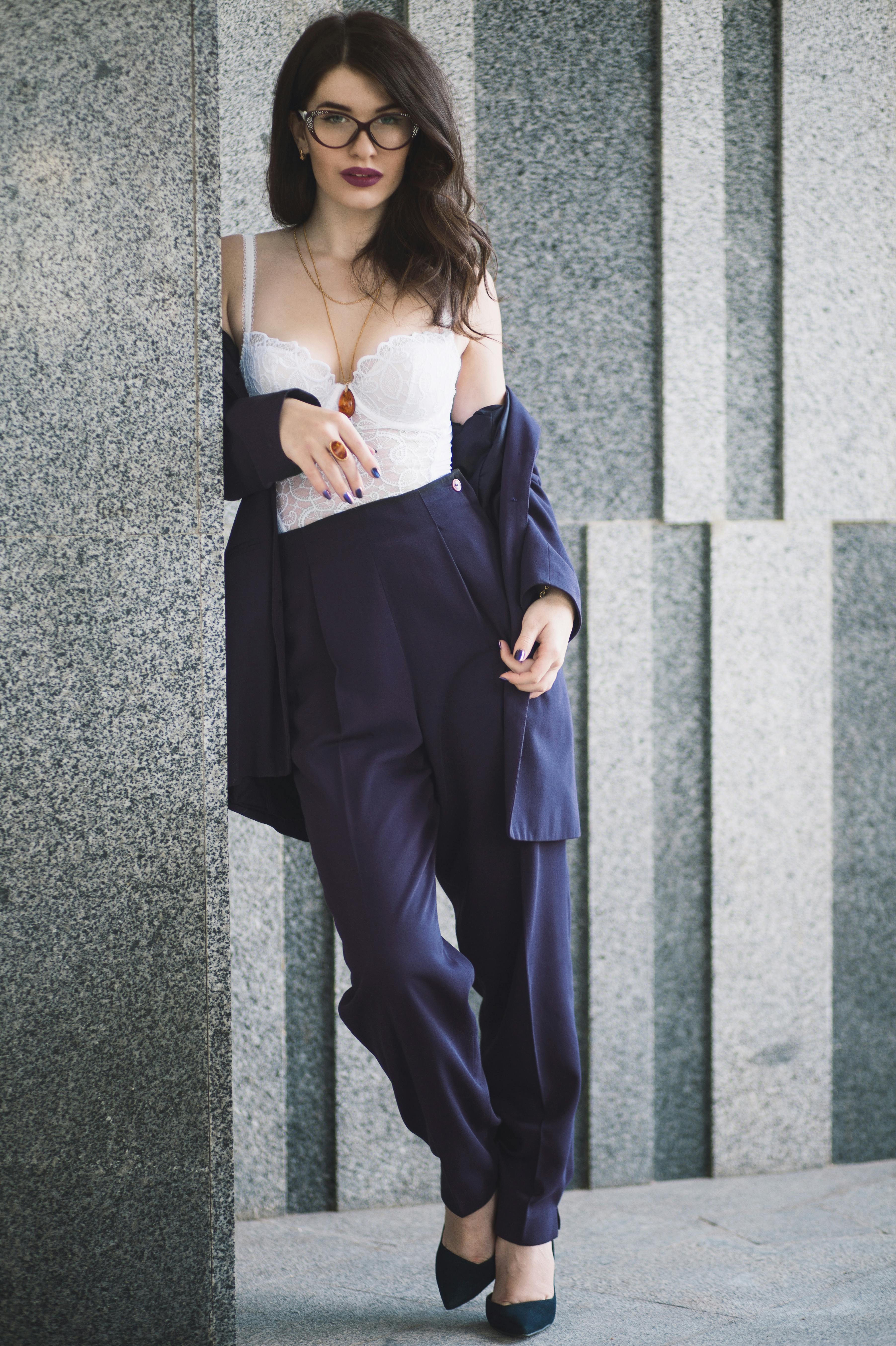 Woman in White Spaghetti Strap Top and Brown Pants · Free Stock Photo