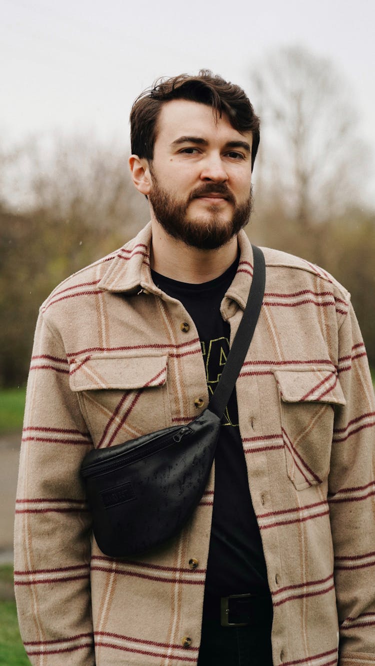 A Man Carrying A Leather Fanny Pack