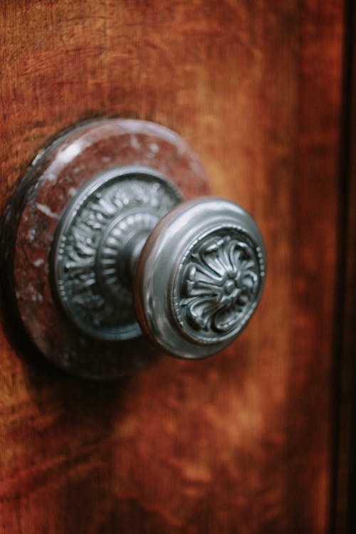 Free Silver Door Knob on Wooden Door Stock Photo