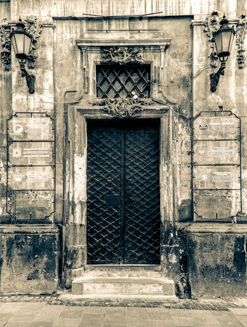 Black and White Photo of a Steel Door of a Historical Building