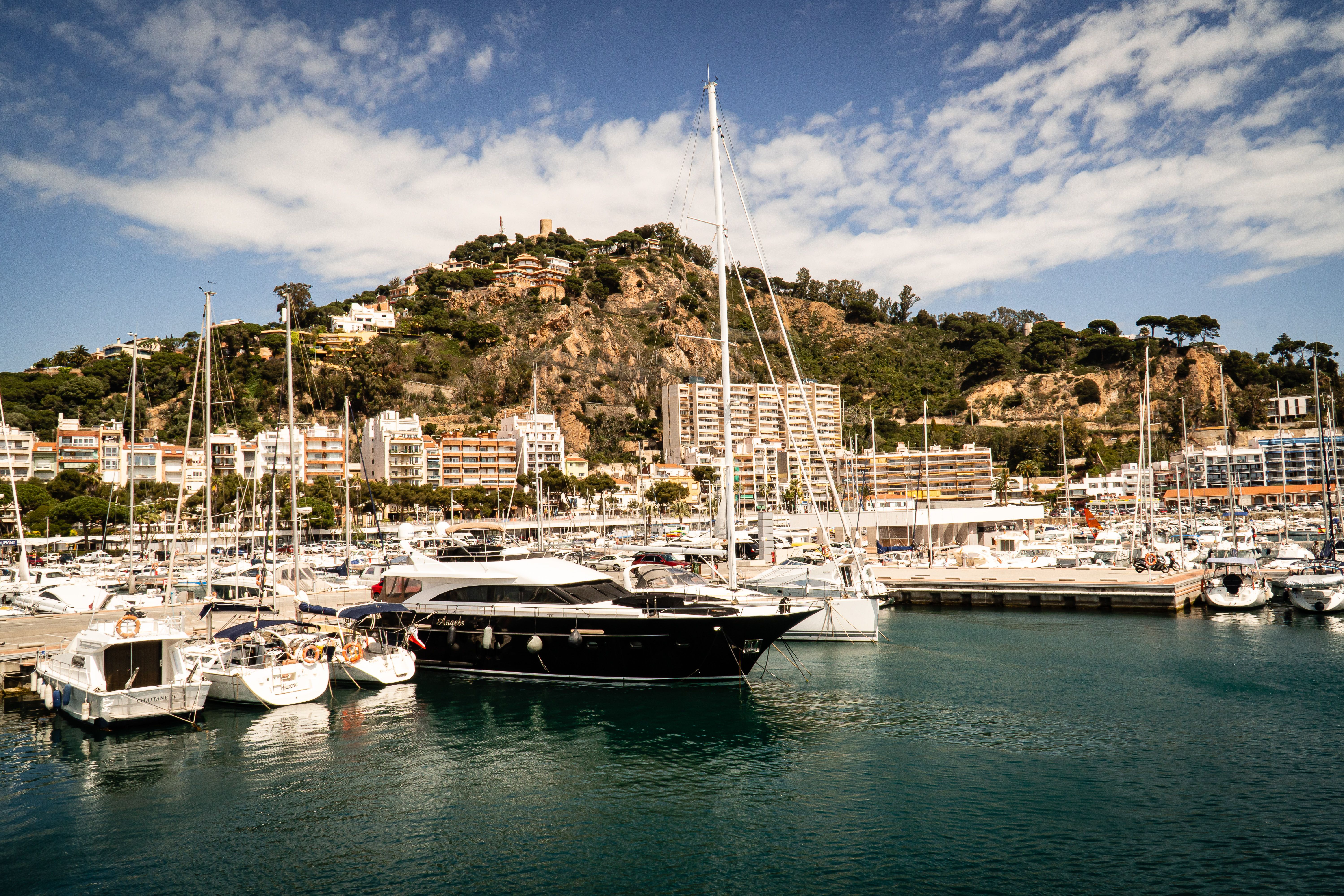 Unbeatable Sunset Sailing Experience w/ Live Spanish Guitar & Spanish Tapas Review: Barcelona's Most Romantic Evening on the Water Review 2026 - Picturesque marina with yachts in vibrant Mediterranean setting, perfect for travel and leisure.