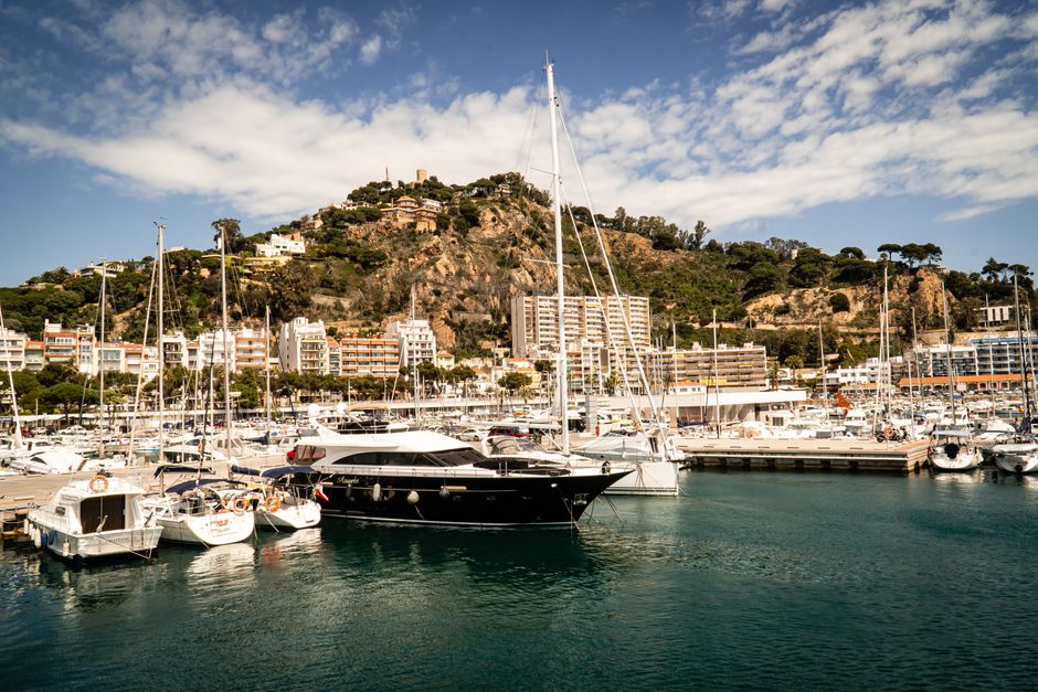 Unbeatable Sunset Sailing Experience w/ Live Spanish Guitar & Spanish Tapas Review: Barcelona's Most Romantic Evening on the Water Review 2026 - Picturesque marina with yachts in vibrant Mediterranean setting, perfect for travel and leisure.