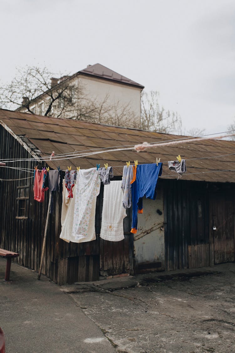 Clothes Drying On Lines Near Shed