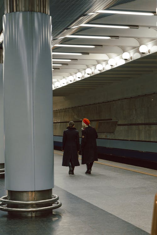 Women Walking at a Metro Station 