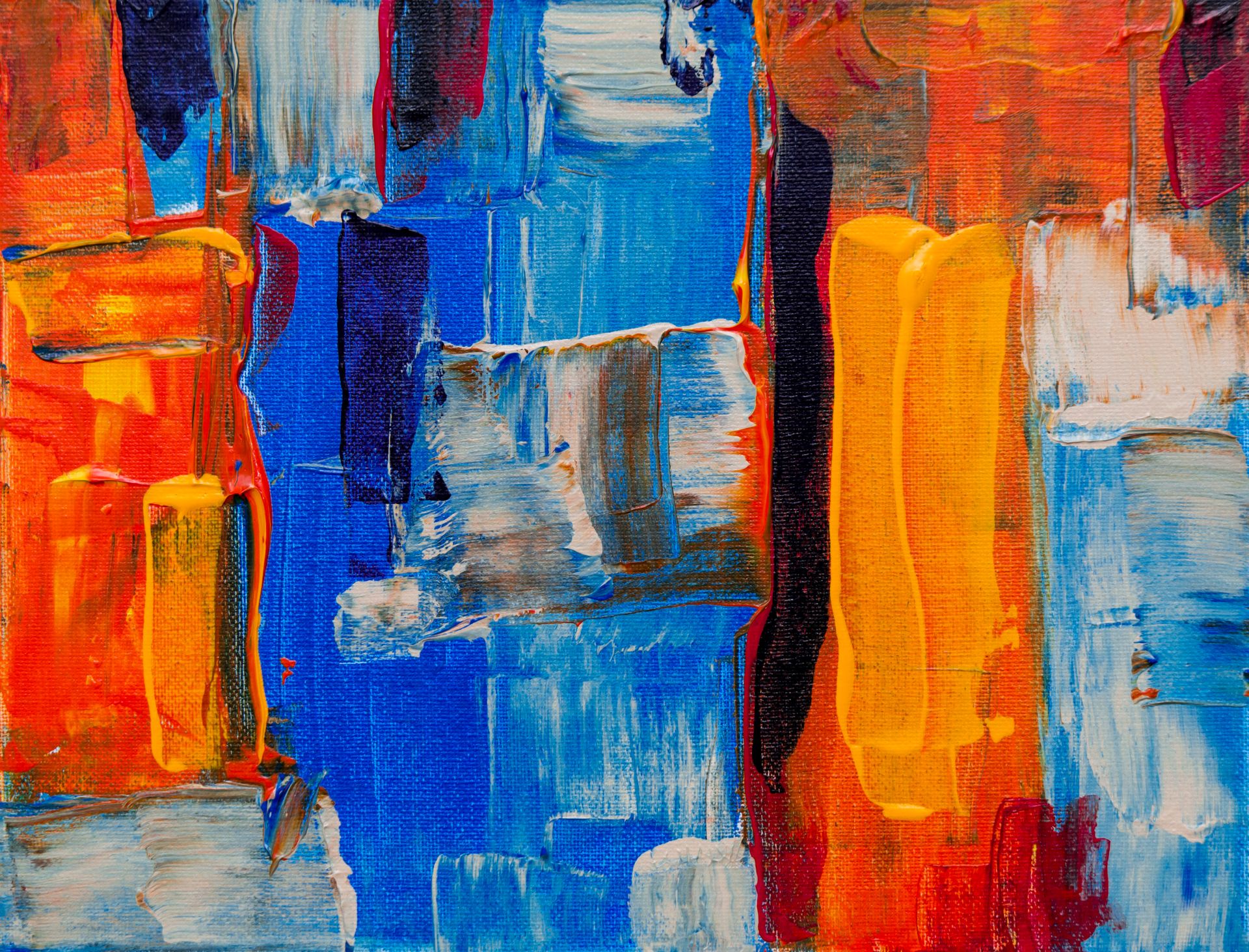 Colorful abstract painting featuring bold acrylic strokes and bright hues on canvas.
