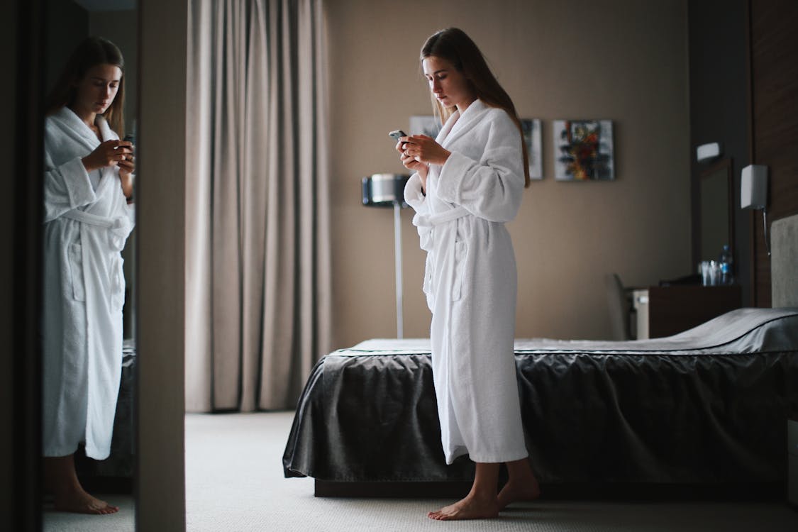 Woman Wearing Robe Reflected in Mirror · Free Stock Photo