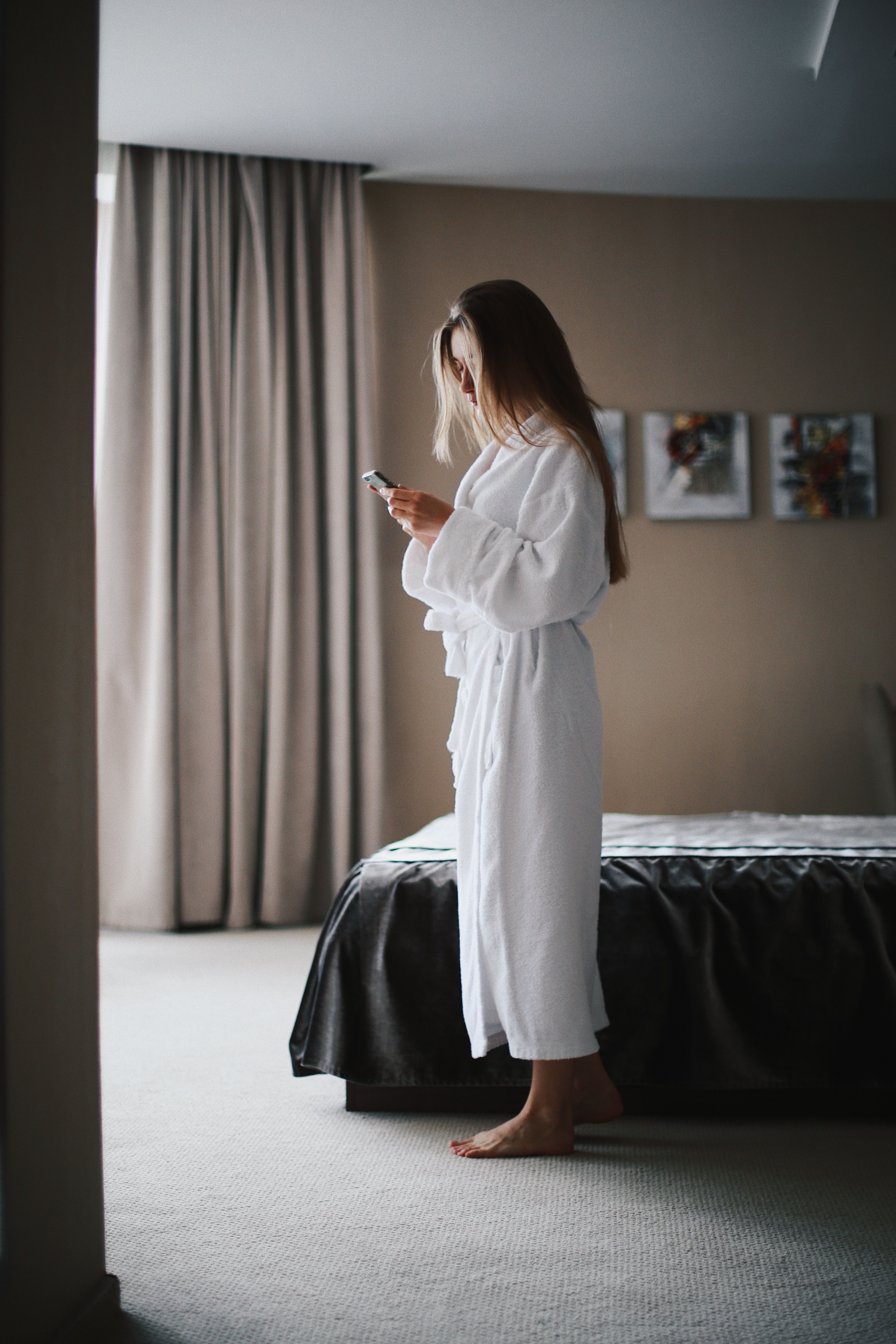 person booking hotel on smartphone