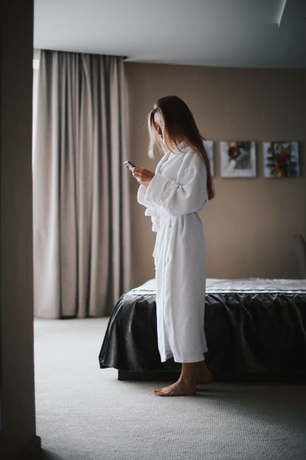 person booking hotel on smartphone