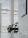 Black Car Parked Beside White Concrete Building