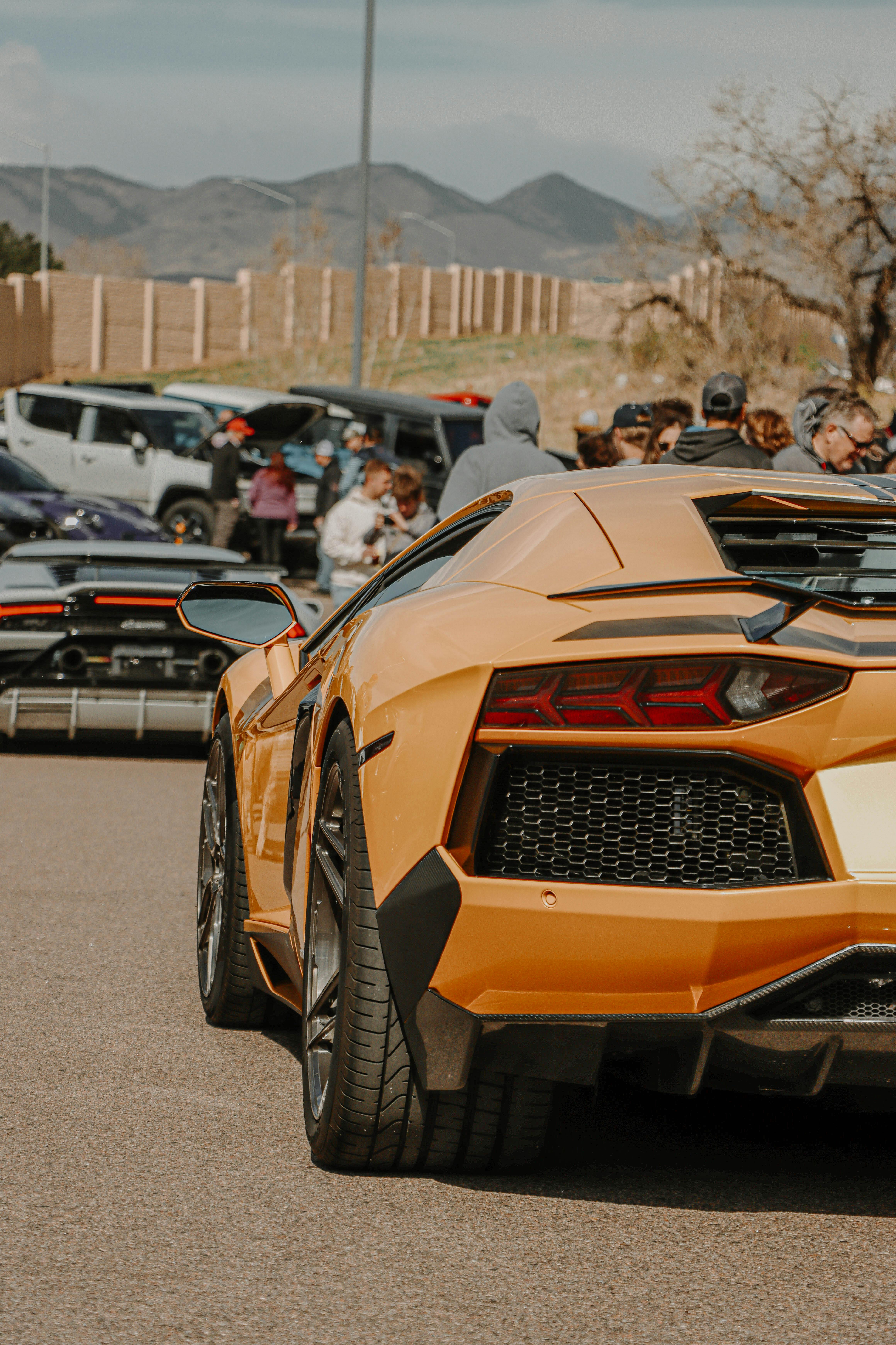 a yellow lamborghini parked on the road