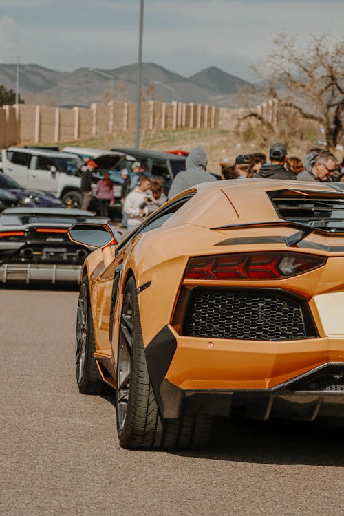 Free A Yellow Lamborghini Parked on the Road Stock Photo