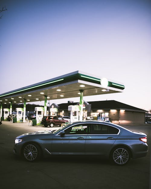 A Black Sedan Parked on the Gasoline Station