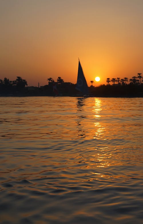 Sailboat in orange sunset
