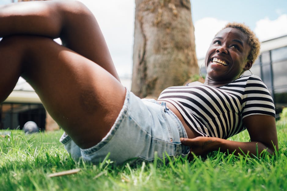 A woman laying down with her natural short cut