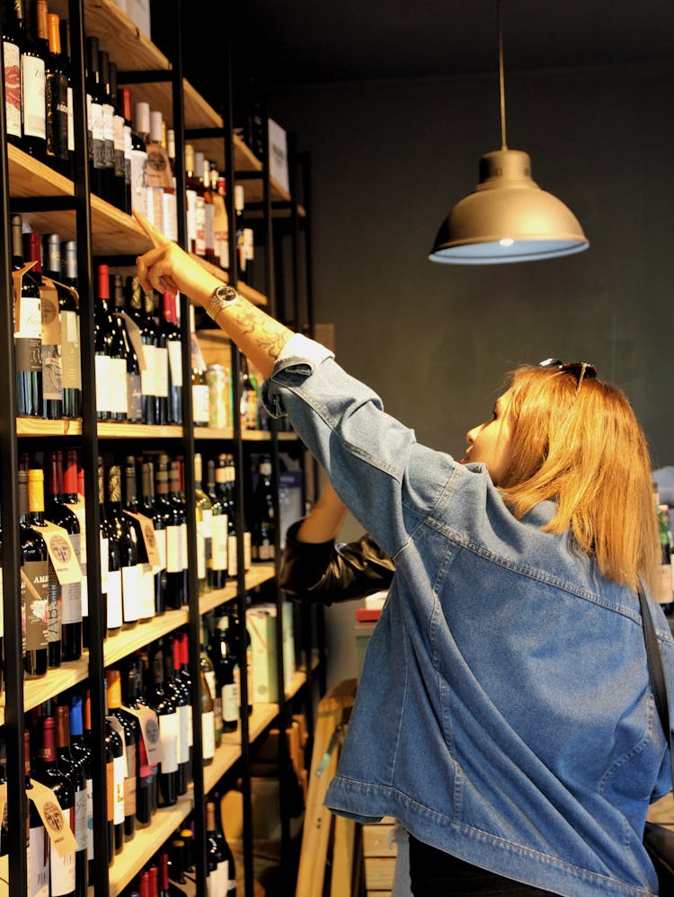 A Woman Choosing Wine