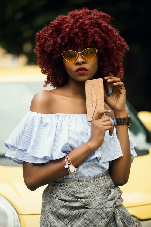 Woman Wearing Gray Off-shoulder Shirt and Sunglasses