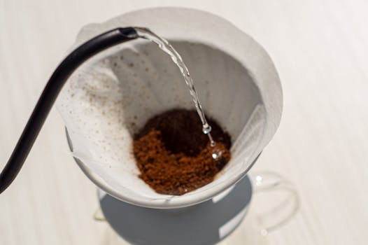 Close-up of coffee being brewed in a filter with hot water in Nazilli, Turkey.