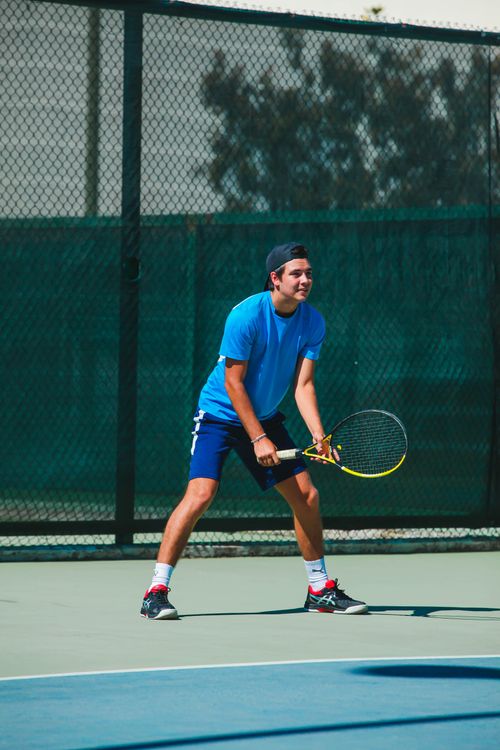 Man Using Tennis Racket A Man Holding a Tennis Racket · Free Stock Photo