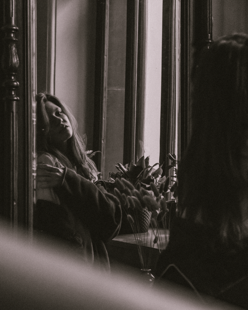 Free Artistic portrait of a woman with long hair, reflecting in a mirror in Saint Petersburg. Stock Photo
