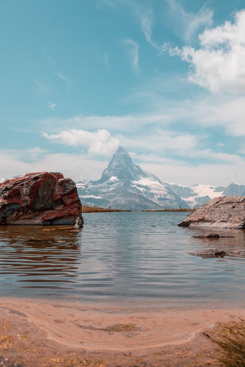 Free Beautiful view of the Matterhorn and Stellisee lake in Zermatt, Switzerland during summer. Stock Photo