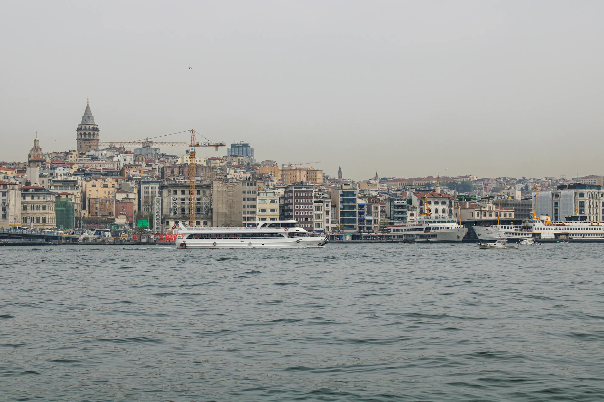 Ferries Sailing on the Sea Near City Buildings